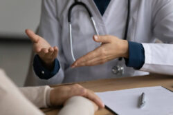 A doctor speaking with a patient. Learn more about dilaudid effects and the risk of addiction, as well as treatment options, here.