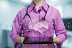 A doctor holding a projection of a brain. Learn more about how cannabinoids affect the brain here.
