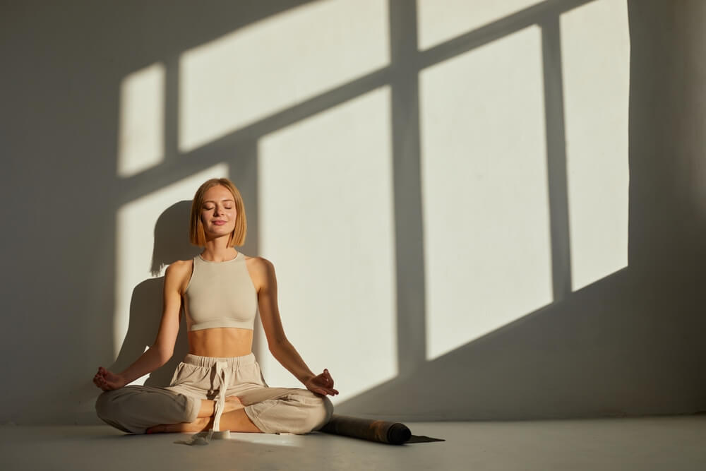 A woman meditating. Learn more about just for today meditation for NA here.