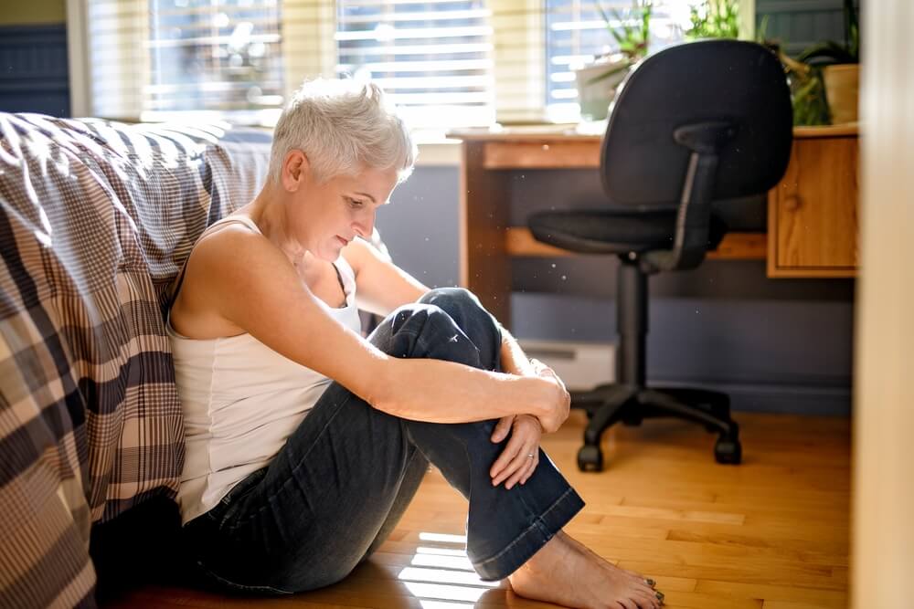 A depressed woman sits on the floor. Learn more about morphine side effects, use, and risks here.