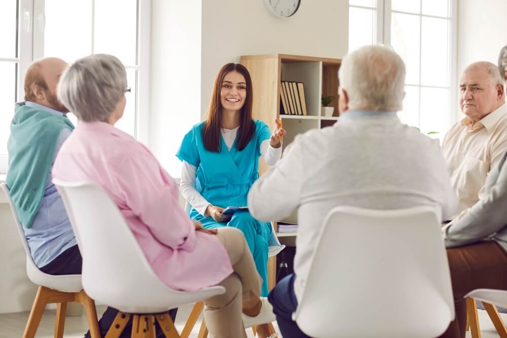 A doctor leads a support group. Learn more about SMART recovery support groups for addiction help, here.
