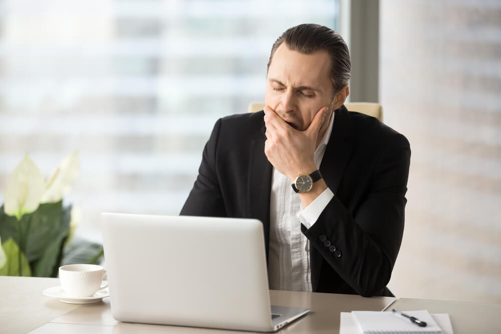 A ma yawns at his desk. Learn more about tramadol here.